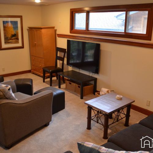Unwind in the comfortable living area, complete with a large, smart tv that provides access to multiple streaming options. Whether you're looking for a cozy movie night or a lively game night with family and friends, this space has everything you need for a memorable stay.