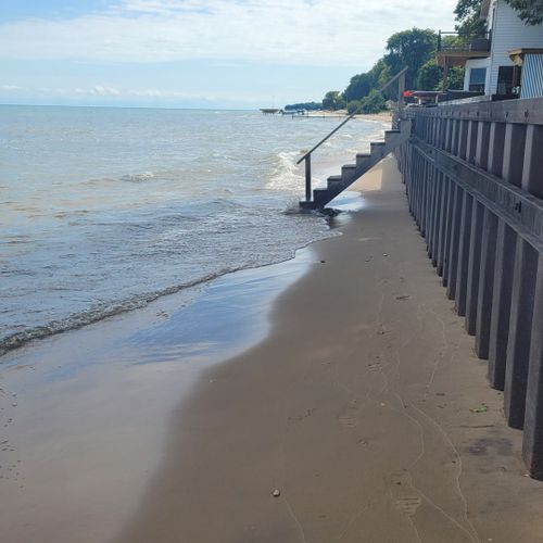 Overall:  the private stairs to the beach and private beach and lakefront.