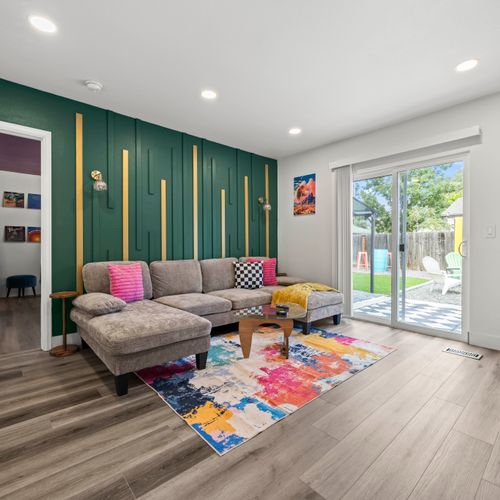The living room flows seamlessly into the backyard for easy indoor-outdoor living.