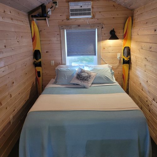 Overview:  the queen-size bed and a/c unit.