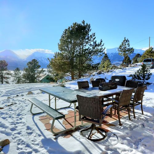 The seating area and grill are shared between the cabins.