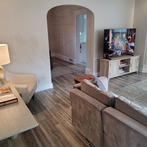 LIVING ROOM:  Gorgeous living room that features a gas fireplace and a large television with live streaming via Hulu, Netflix, and Disney+.