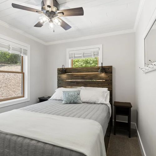BEDROOM #3 (UPPER LEVEL):  Very cute upper level bedroom with a queen-size bed, nightstands, ceiling fan, mirror, and closet.