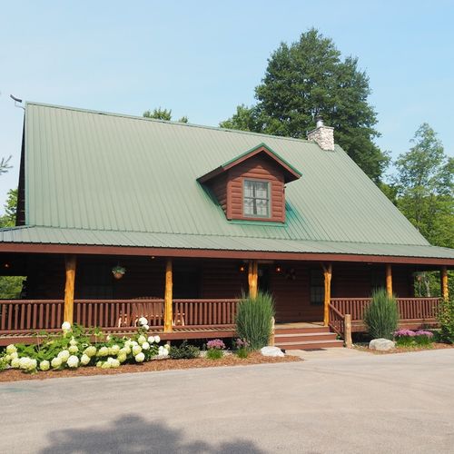 Overall:  the front of the cabin in summer.