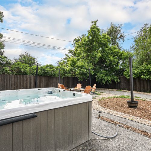 Soak stress away in our private hot tub, set amidst an inviting rock landscape. Your outdoor getaway awaits!