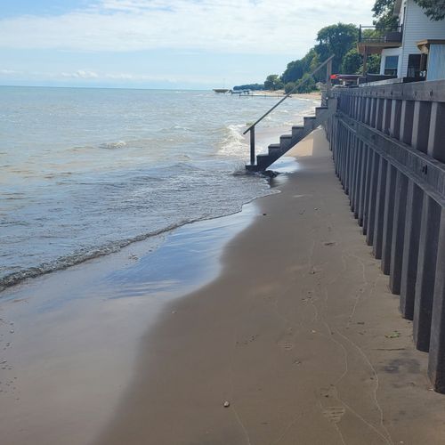 Overall:  the private stairs to the beach and private beach and lakefront.
