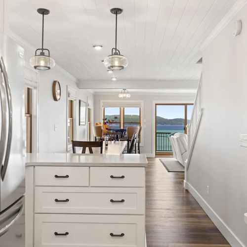 KITCHEN (MAIN FLOOR):  The home has a beautiful modern kitchen with all appliances (including a dishwasher) and a good supply of cooking and dining utensils