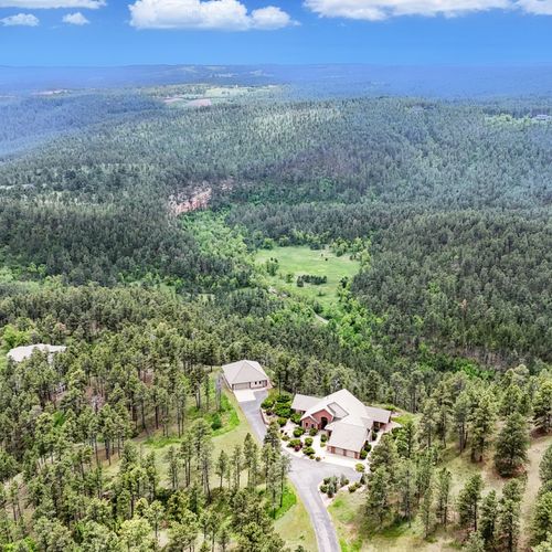 Secluded mountain escape surrounded by peaceful pine trees and panoramic views.