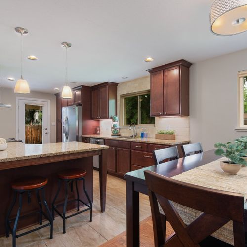 Experience the open concept design as the kitchen flows seamlessly into the dining area.