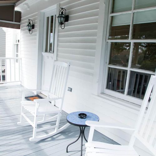 Breezy balcony w/ a serene outdoor view.