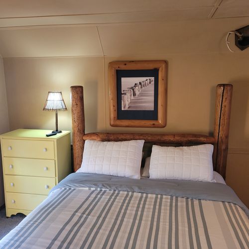 BEDROOM #3 (SECOND FLOOR):  Features a queen-size bed, comfy chair, sofa bed, baby crib, ceiling fan, dresser, and private live-streaming television.