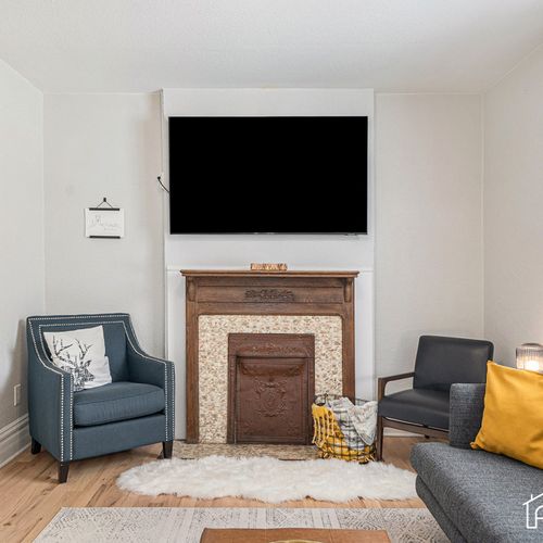 Dive into relaxation in our living room, featuring a large smart tv for your enjoyment!