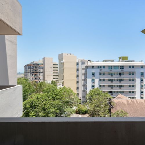 Olimpo | Room With Balcony 31 Private Balcony View. Enjoy fresh air and the urban vista of San Juan.