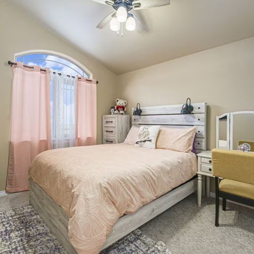 Sink into comfortable bedding, enjoy soft carpeting, and let sunlight gently fill the room.
