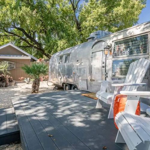 Soak up the sun on the two Adirondack with your coffee each morning at the Airstream