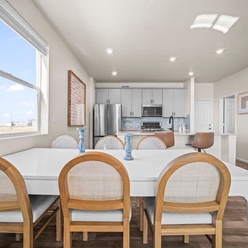 Dining space flows seamlessly into the kitchen, perfect for hosting.
