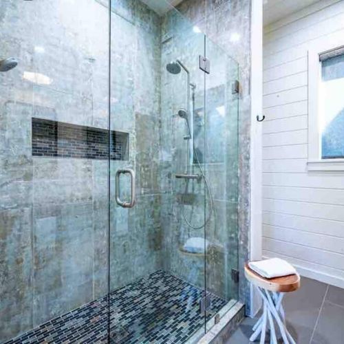 A double head walk-in shower for the private bathroom.
