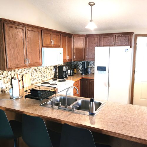 KITCHEN:  The home has a cute and modern kitchen with all appliances, except for a microwave and a dishwasher.