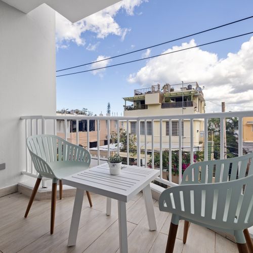 Enjoy your morning coffee with a breath of fresh air on this private balcony.