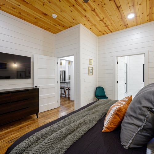 A dresser and smart tv come in the suite for guests to use.