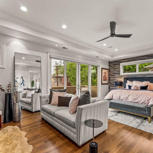 A suite within a suite—this expansive master bedroom includes a private lounge area.