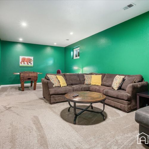 Comfortably gather with friends and family to watch your favorite shows or engage in some friendly competition at the foosball table.