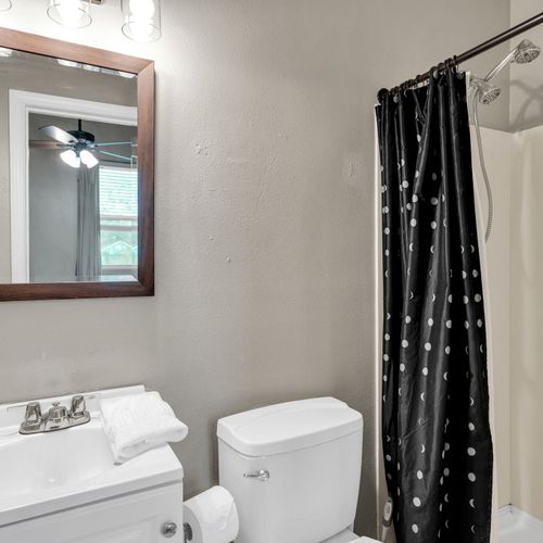 Fresh bathroom w/ a sink & natural light for a clean, easy start to your day.
