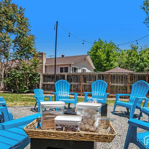 The chairs around the firepit are perfectly poised for a s'mores adventure, promising fun, laughter, and sweet treats as everyone gathers to roast marshmallows and make memories.