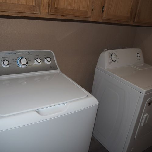 Laundry room:  the cabin has a convenient laundry just inside the front door with a large top load washer and dryer.