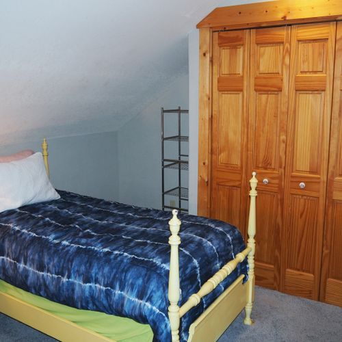 Bedroom #3 (second floor):   features 2 twin beds, private television, comfy chair, and a closet.