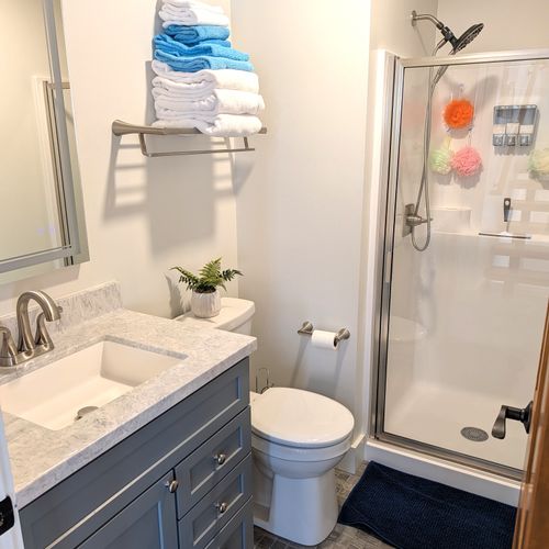 BATHROOM #1 (MAIN FLOOR):  Full bathroom on the main floor with a walk-in shower.