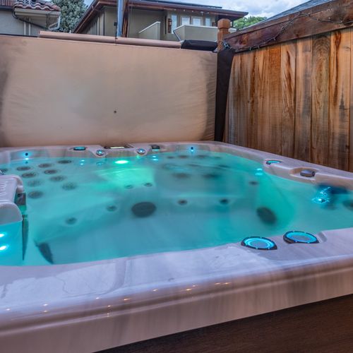 A true essential—soak your stress away in the inviting hot tub!
