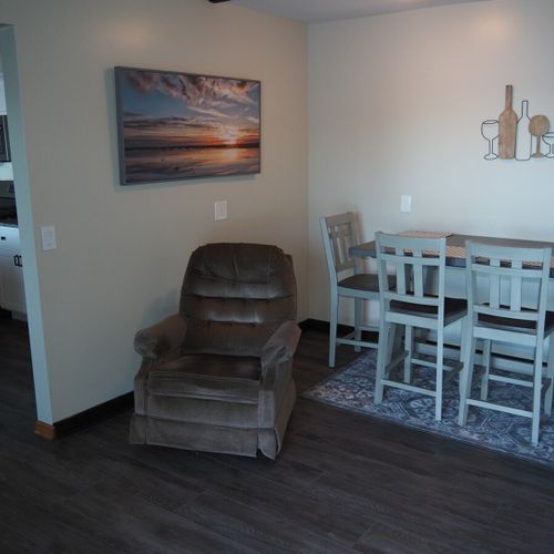 Dining area:  in-between the kitchen and the living room is a small dining area and cozy chair that's in front of the television.