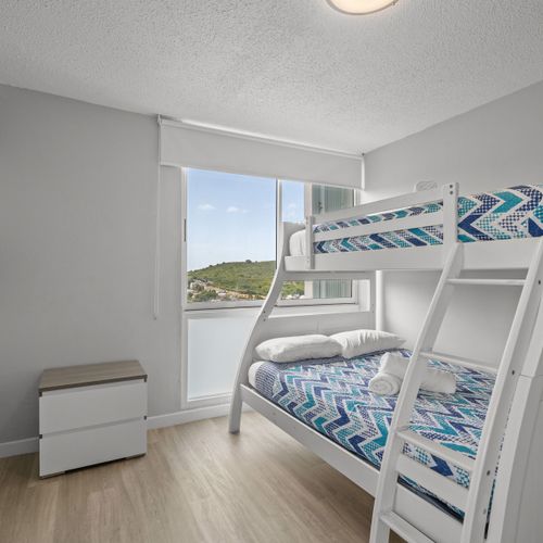 More adventures, more comfort! This bright room features another set of cozy bunk beds, offering flexible sleeping arrangements and fun for families or groups.