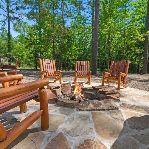 The fire pit with chairs surrounding!