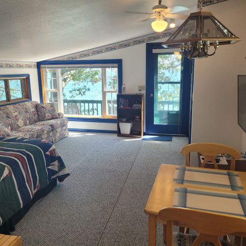 Main room:  the main room showing the queen-size bed, sofa bed, dining table, and television
