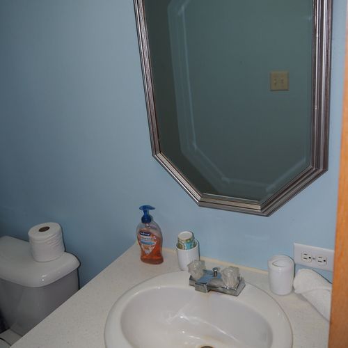 Bathroom #2:  the sink, mirror, vanity, and toilet