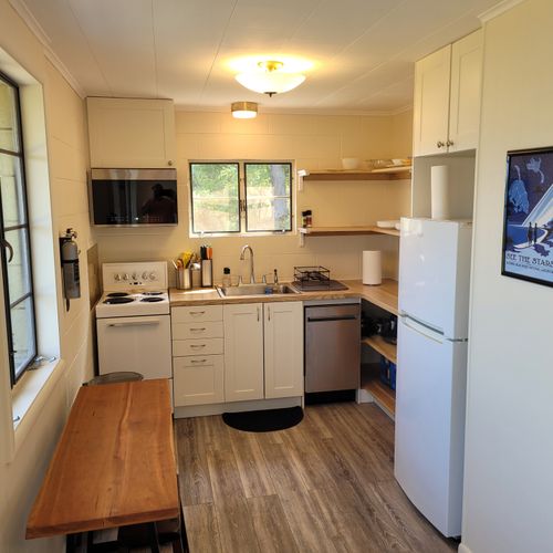 Kitchen:  the home has a very cute and newly updated kitchen with all appliances, including a dishwasher. Also includes a small breakfast nook with stools and a great view of crystal lake!