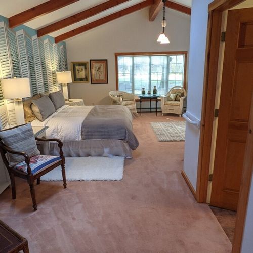 Bedroom #1 (first floor):  this bedroom has a long private entryway that opens up into an incredibly large bedroom with its own king size bed, television, library, sitting area, and private en suite bathroom.