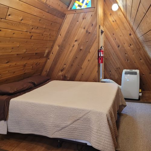 Bedroom #3 (no door / open to stairwell):  large upstairs loft bedroom features a queen-size bed and a trundle bed (i. E. A twin bed with a twin bed below it). Also has its own a/c unit.