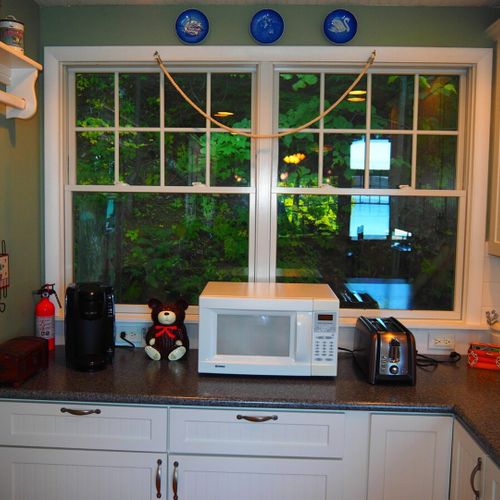 Kitchen:  the home has a large, beautiful, and very functional kitchen with all appliances including a dishwasher. There is a good supply of cooking and dining utensils included as well.