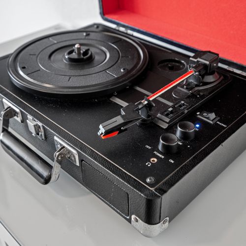 Step into a timeless musical journey with our vintage Crosley record player.