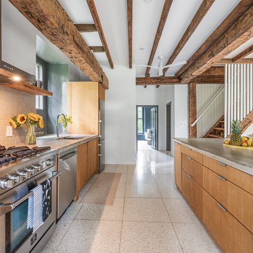 Modern amenities meet old world character in this open-concept kitchen.