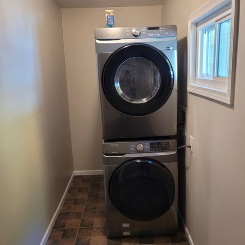 Laundry room:  next to the back door is a very convenient stacked washer and dryer.