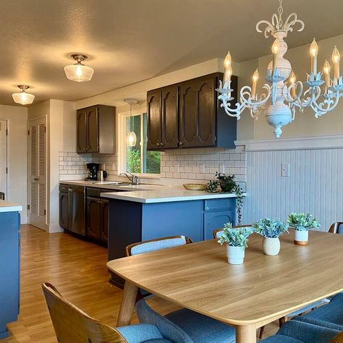 The kitchen and dining room open up to the deck outside adding tons of light to the room.