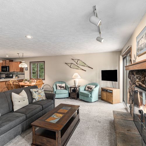 LIVING ROOM:  The large and beautiful living room with wood fireplace and walk-out to the bonfire ring