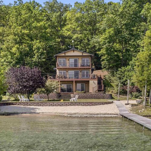 OVERVIEW:   The gorgeous home and its private beach, lakefront, and dock
