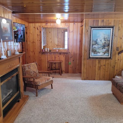 Living room:  very cozy and comfy living room with two sofas, two comfy chairs, a coffee table, and a gas fireplace.