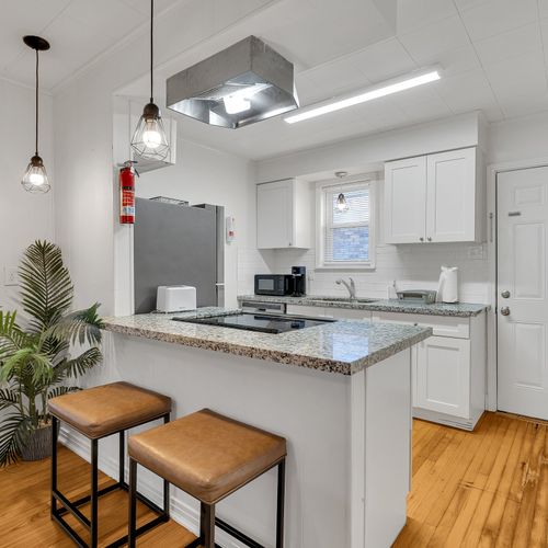 Cook up a feast in this sleek, fully-equipped kitchen featuring stainless steel appliances and granite countertops—perfect for whipping up local favorites!