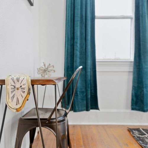 Step into bedroom 2 through a welcoming entryway w/ warm natural light.